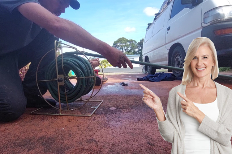 
Tidying up after a day of gutter rinsing, a portstephens professional stows the hose.